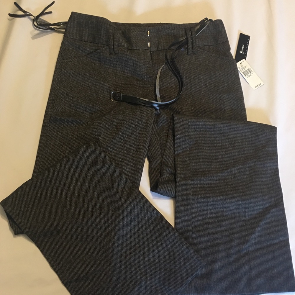 7 pairs of dress pants ranging in sizes 5-7 junior